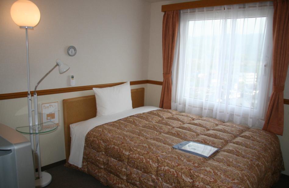 فندق هیغاشیهیروشیمافي  طوكيو إن هيجاشي-هيروشيما سايجو إيكيماي الغرفة الصورة